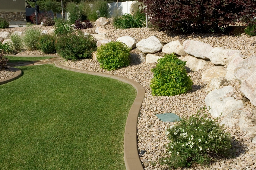 Pebbles over mulch backyard lawn